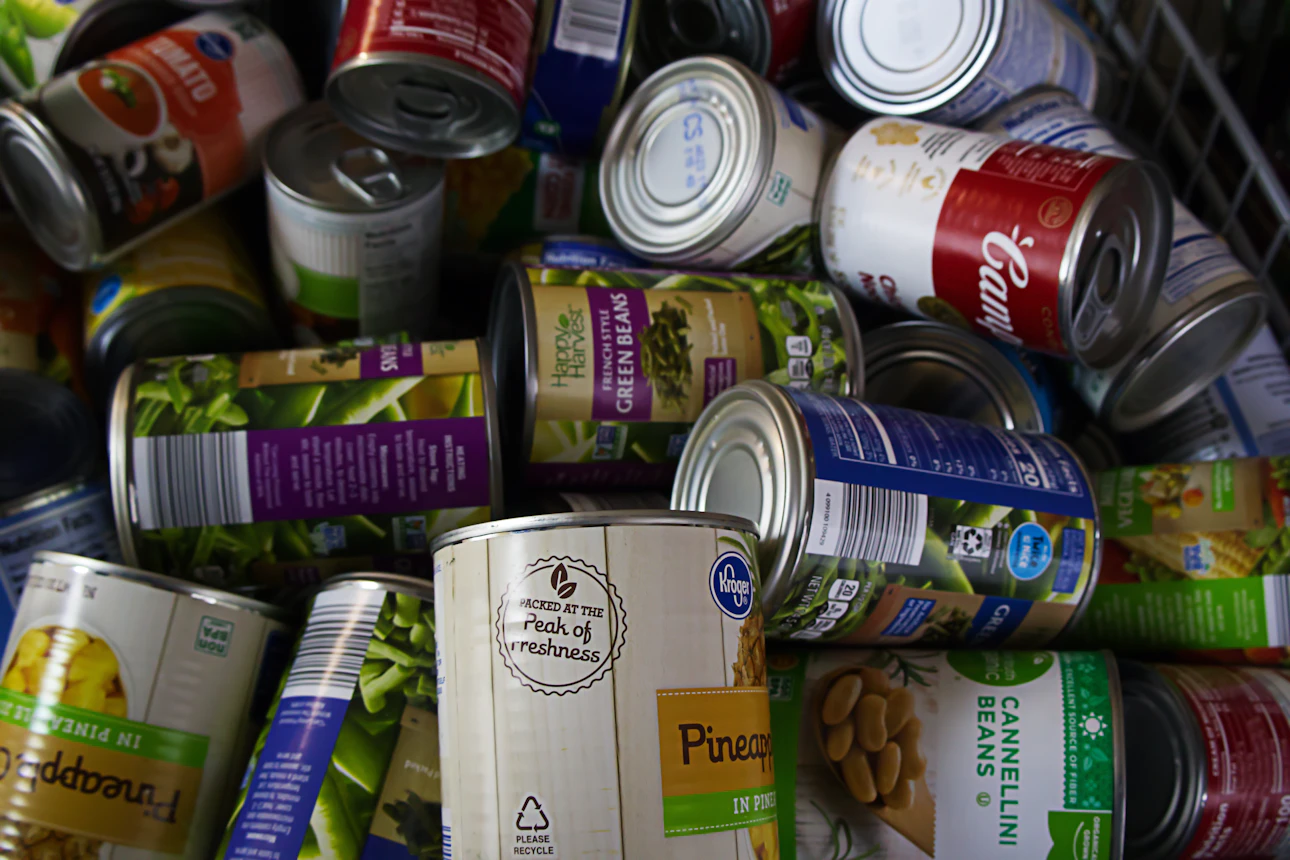 A pile of canned food cans sitting next to each other